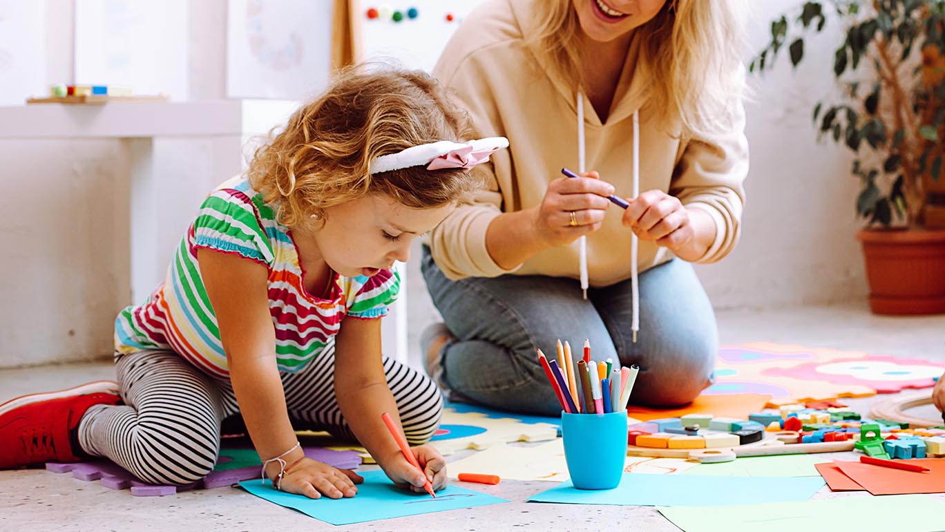 Shelby O'Brien working with young child